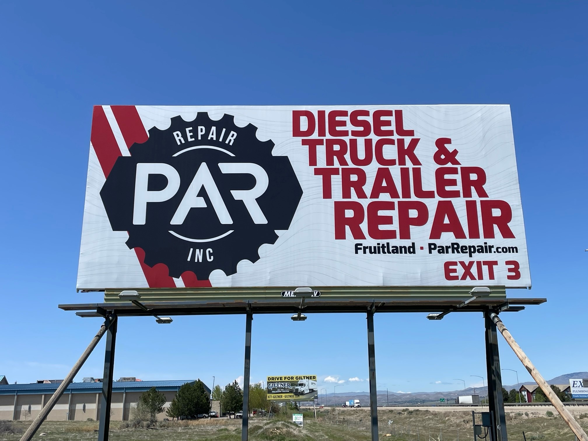 Meadow Outdoor billboard for PAR Repair that is red, white, and black